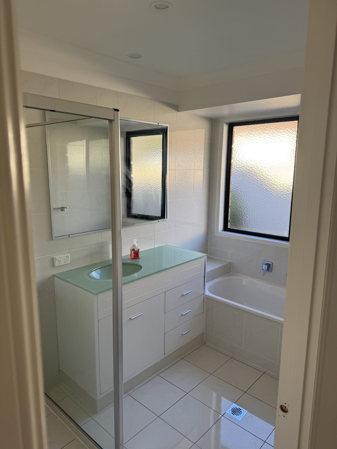 Bathroom repaint with crisp white walls and ceiling