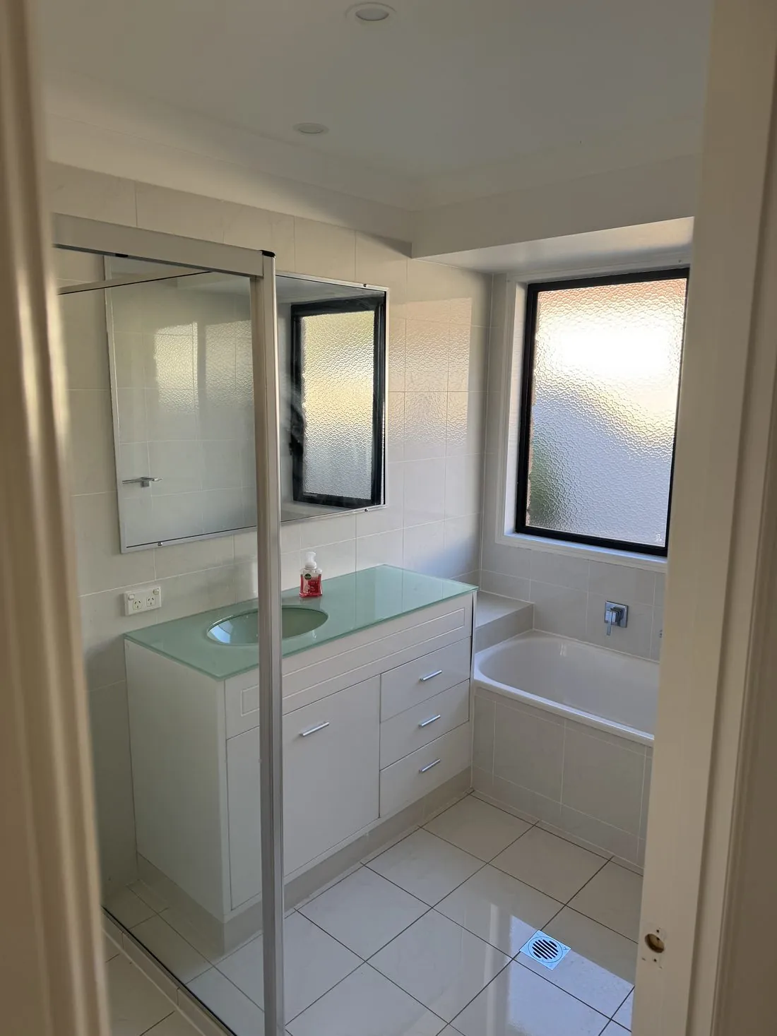 Bathroom repaint with crisp white walls and ceiling