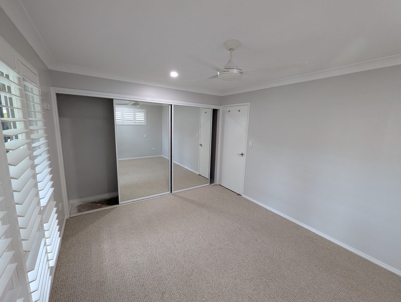 Bedroom repainted in soft neutral tones at Currumbin Waters