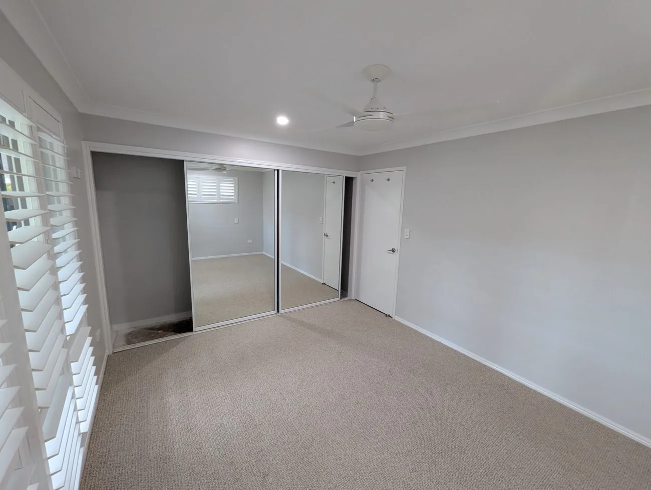 Bedroom repainted in soft neutral tones at Currumbin Waters