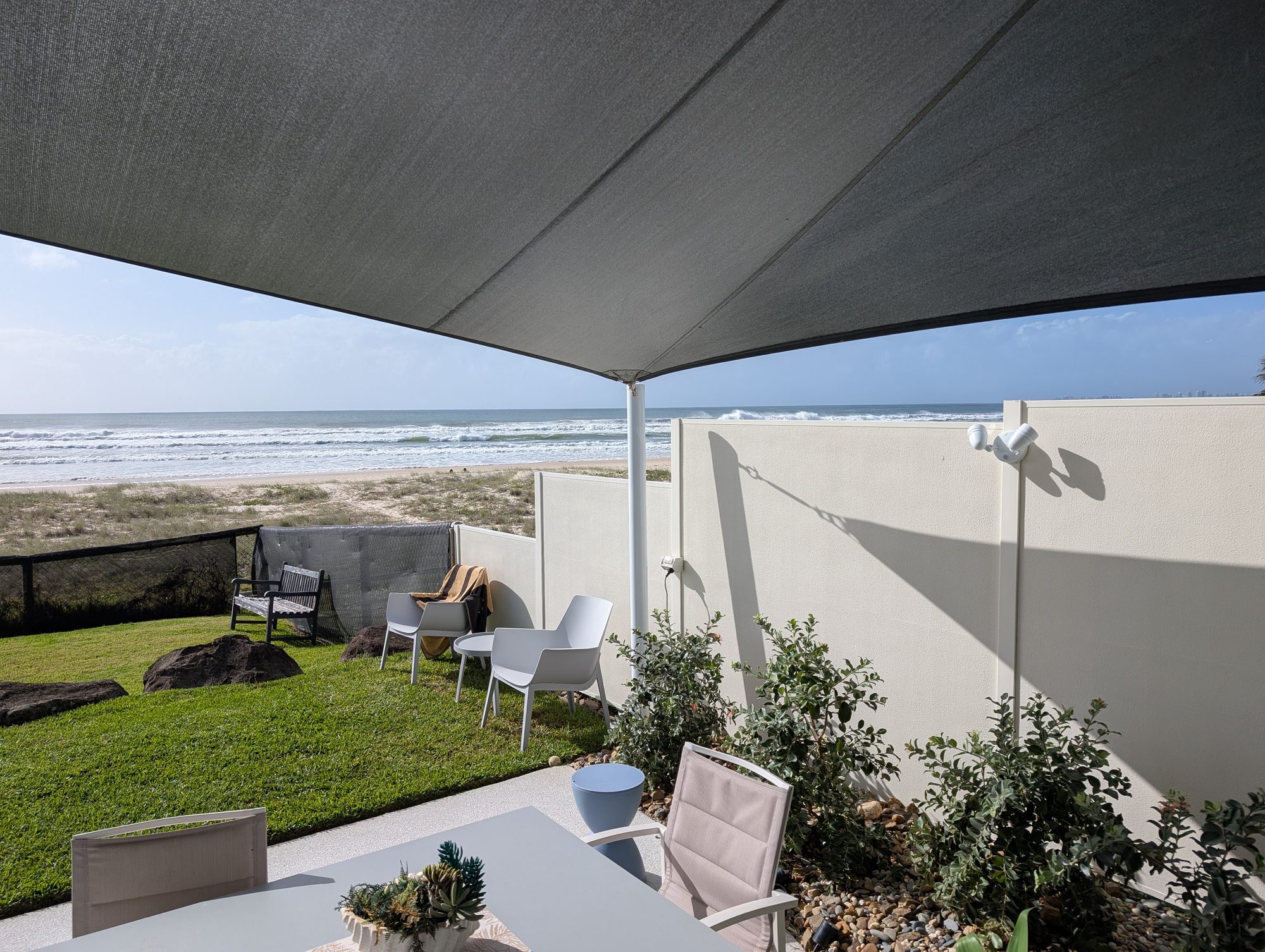 Freshly painted beachfront render wall overlooking the ocean at Palm Beach on the Gold Coast