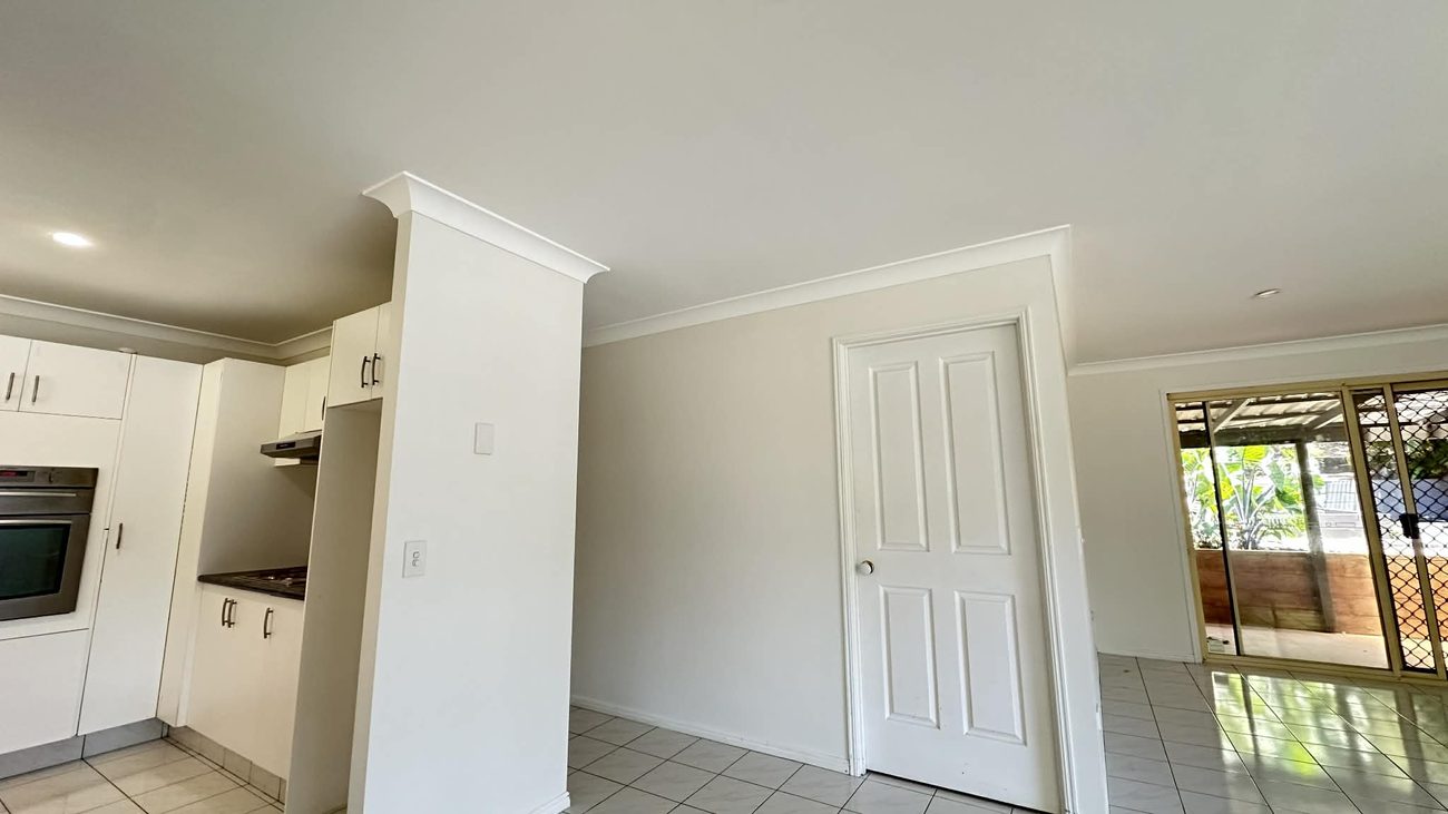 Freshly painted room with white doors and trims at Bilinga