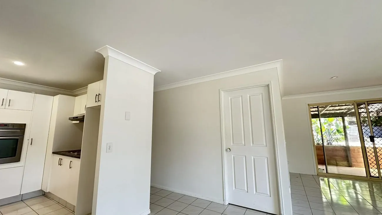 Freshly painted room with white doors and trims at Bilinga