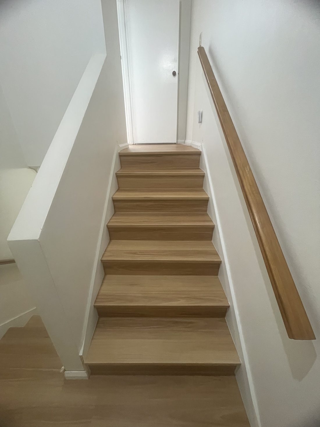 Timber staircase with fresh white walls at Burleigh Waters