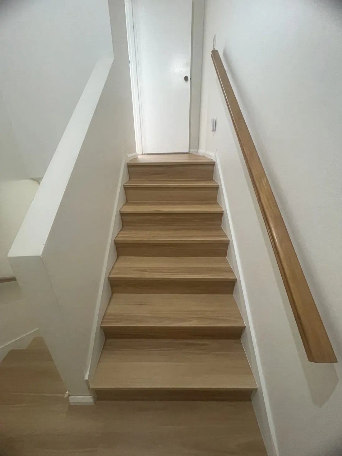 Timber staircase with fresh white walls at Burleigh Waters